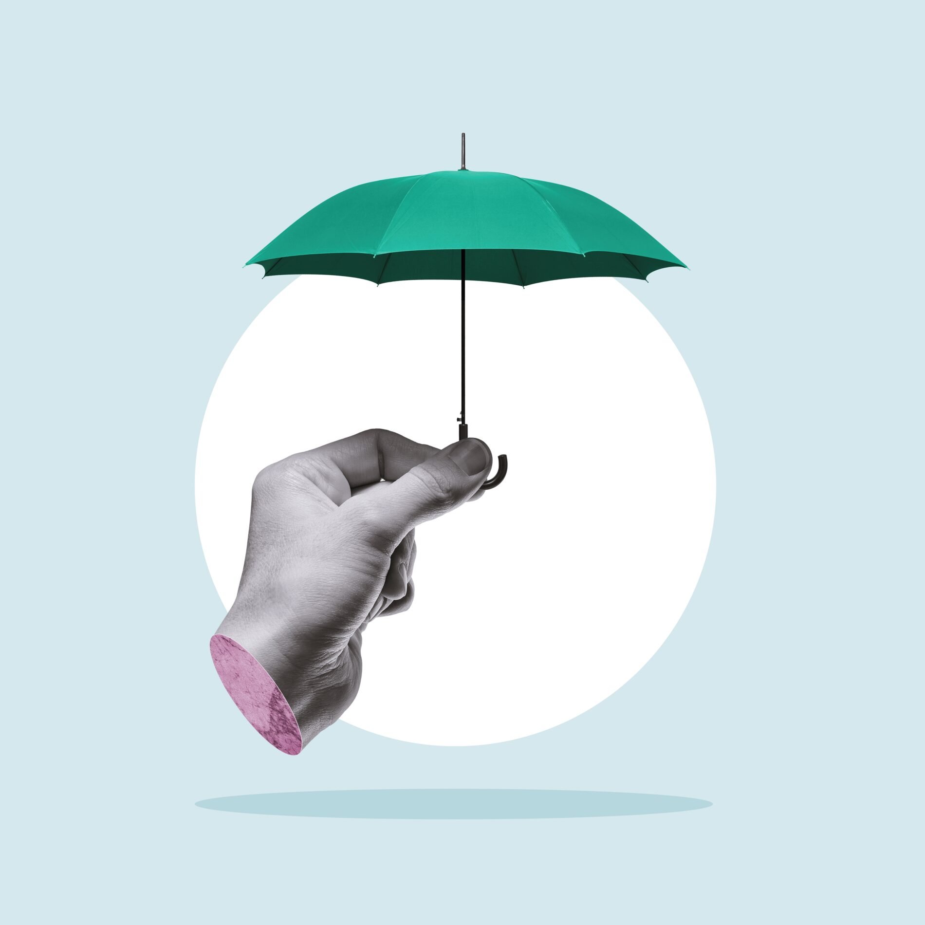 Hand holding umbrella