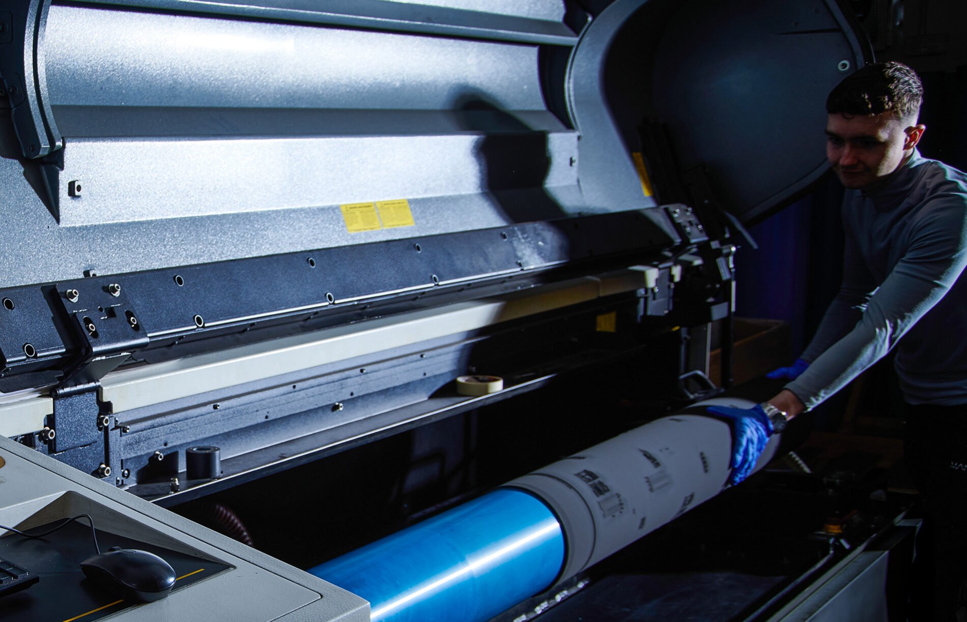 man adjusting contents in a printer